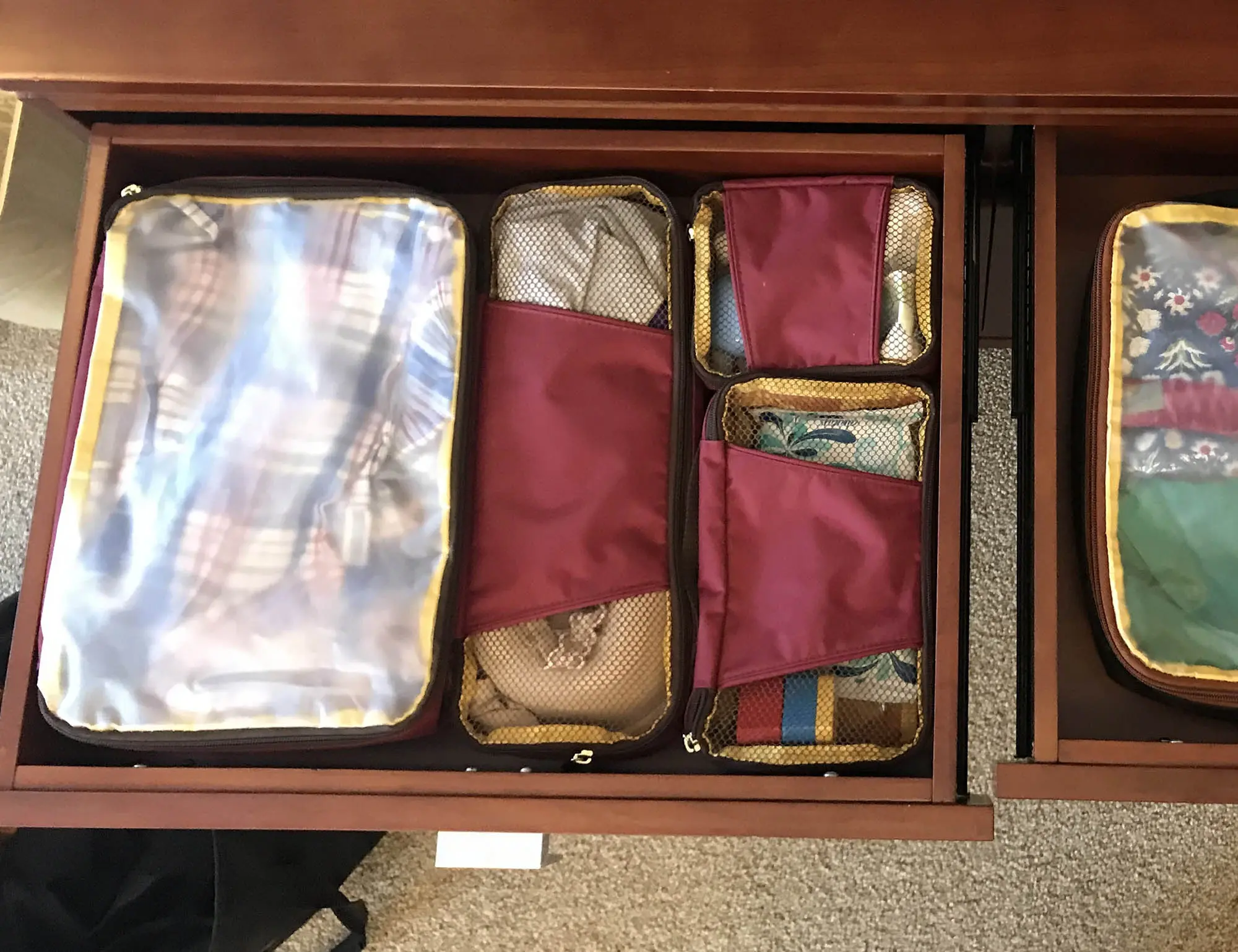 Drawer organized with packing cubes storing underwear and socks.