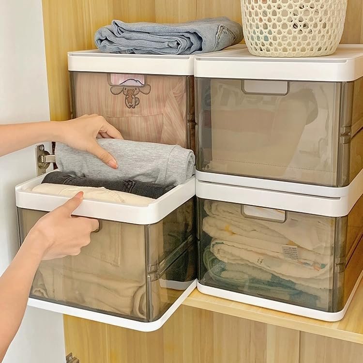 Labeled plastic storage boxes stacked in a hallway closet.
