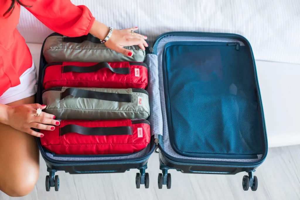 Suitcase packed with color-coded packing cubes for easy access.