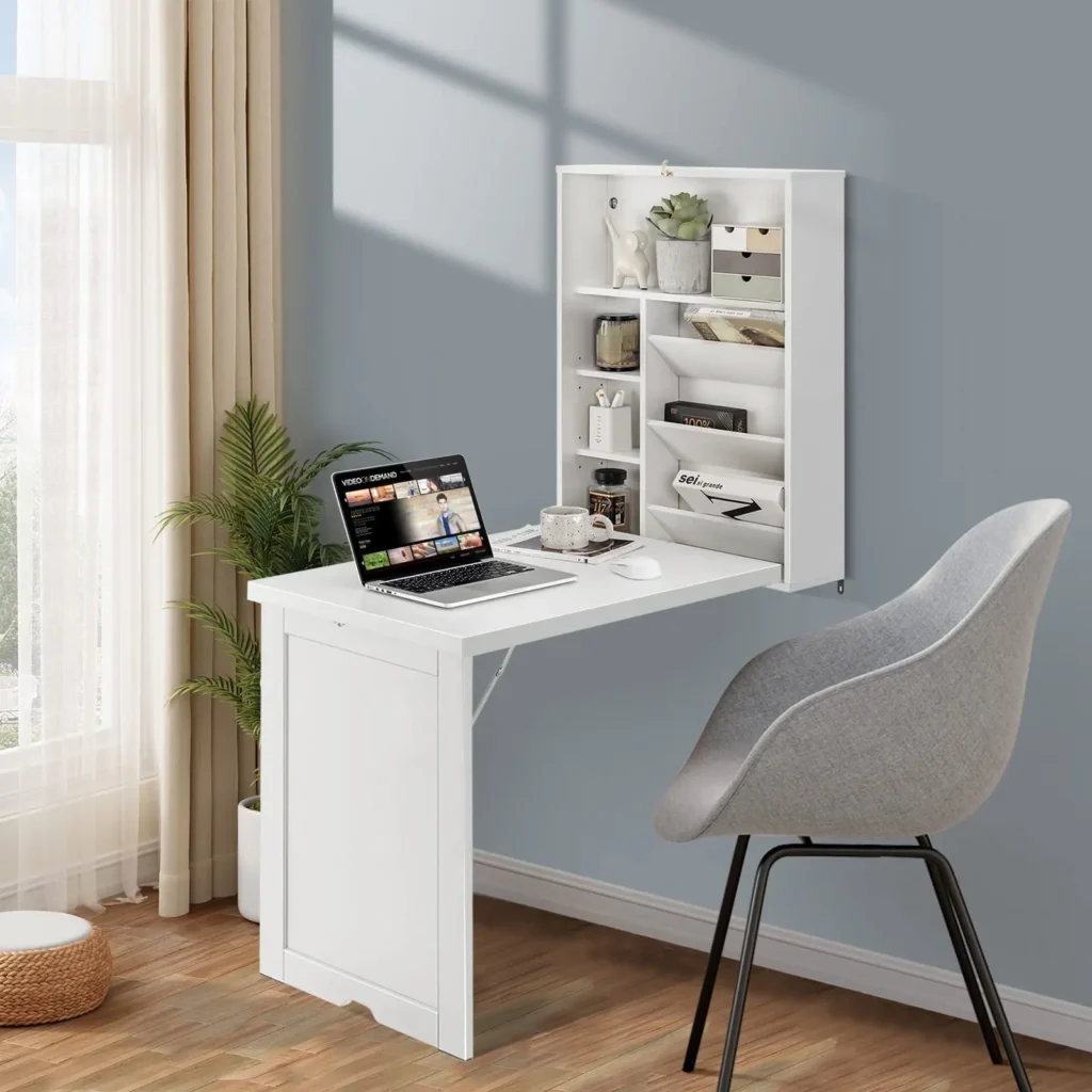 Fold-down wall desk with storage hooks above in a tiny home office nook