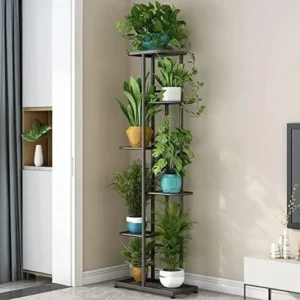 Indoor plant stand with potted greenery displayed in living room corner