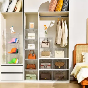 Labeled clear acrylic bins used to store handbags inside closet shelves.