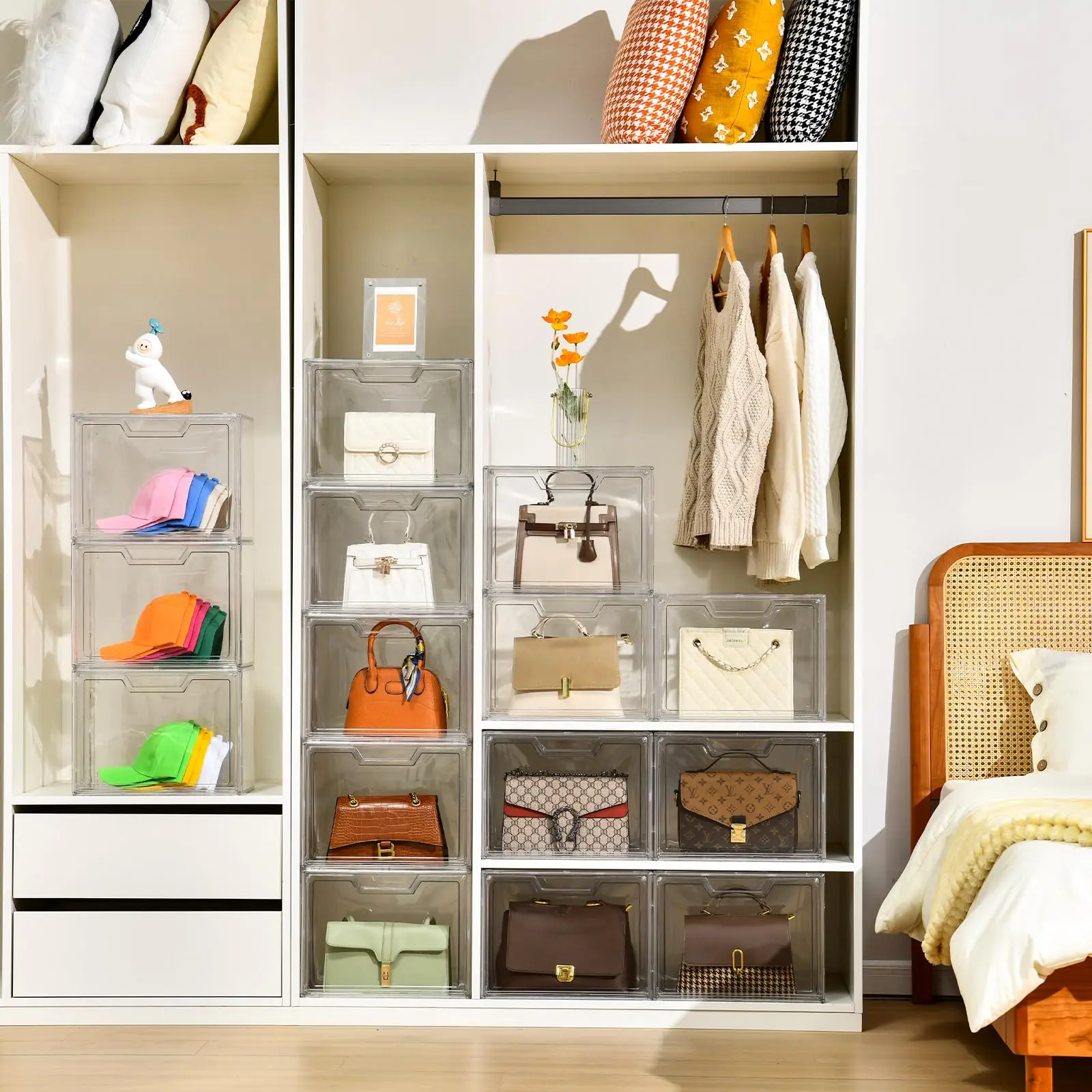 Labeled clear acrylic bins used to store handbags inside closet shelves.