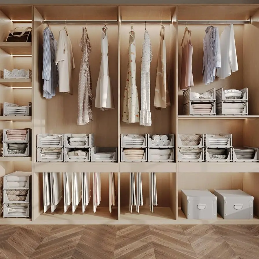Labeled fabric bins holding folded T-shirts by category on a closet shelf