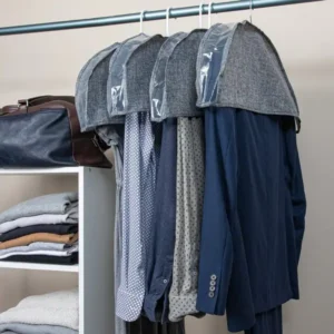 Organized hanging clothes with labels and breathable covers inside storage unit