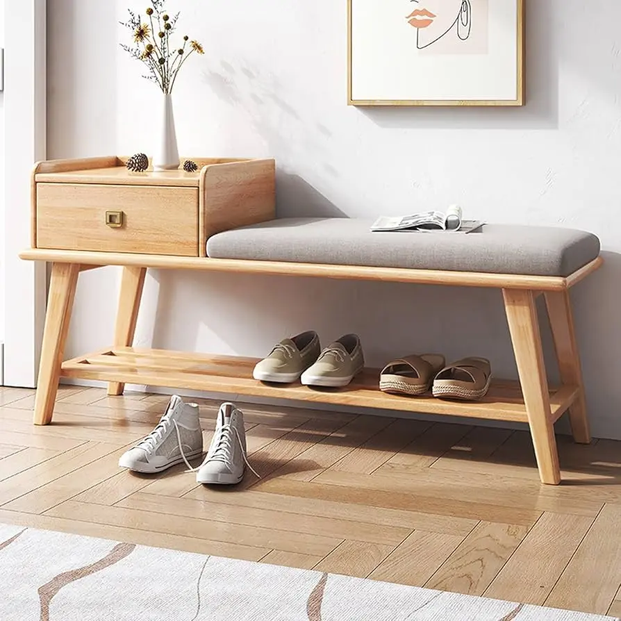 Rustic wooden shoe storage bench in a cozy entryway