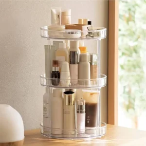 Skincare bottles and cotton pads neatly arranged in rotating countertop organizer