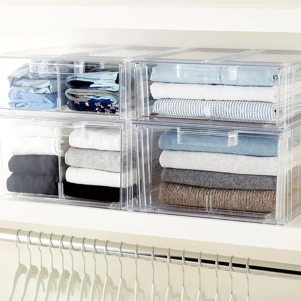 Transparent storage box labeled ‘Winter Sweaters’ placed on a closet shelf