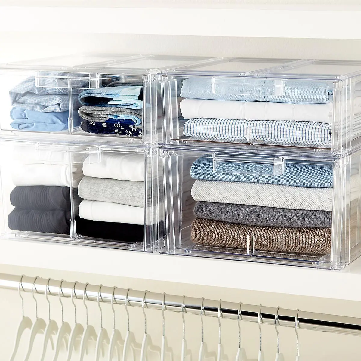 Transparent storage box labeled ‘Winter Sweaters’ placed on a closet shelf