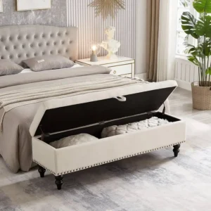 Tufted upholstered storage bench at the end of a king-sized bed