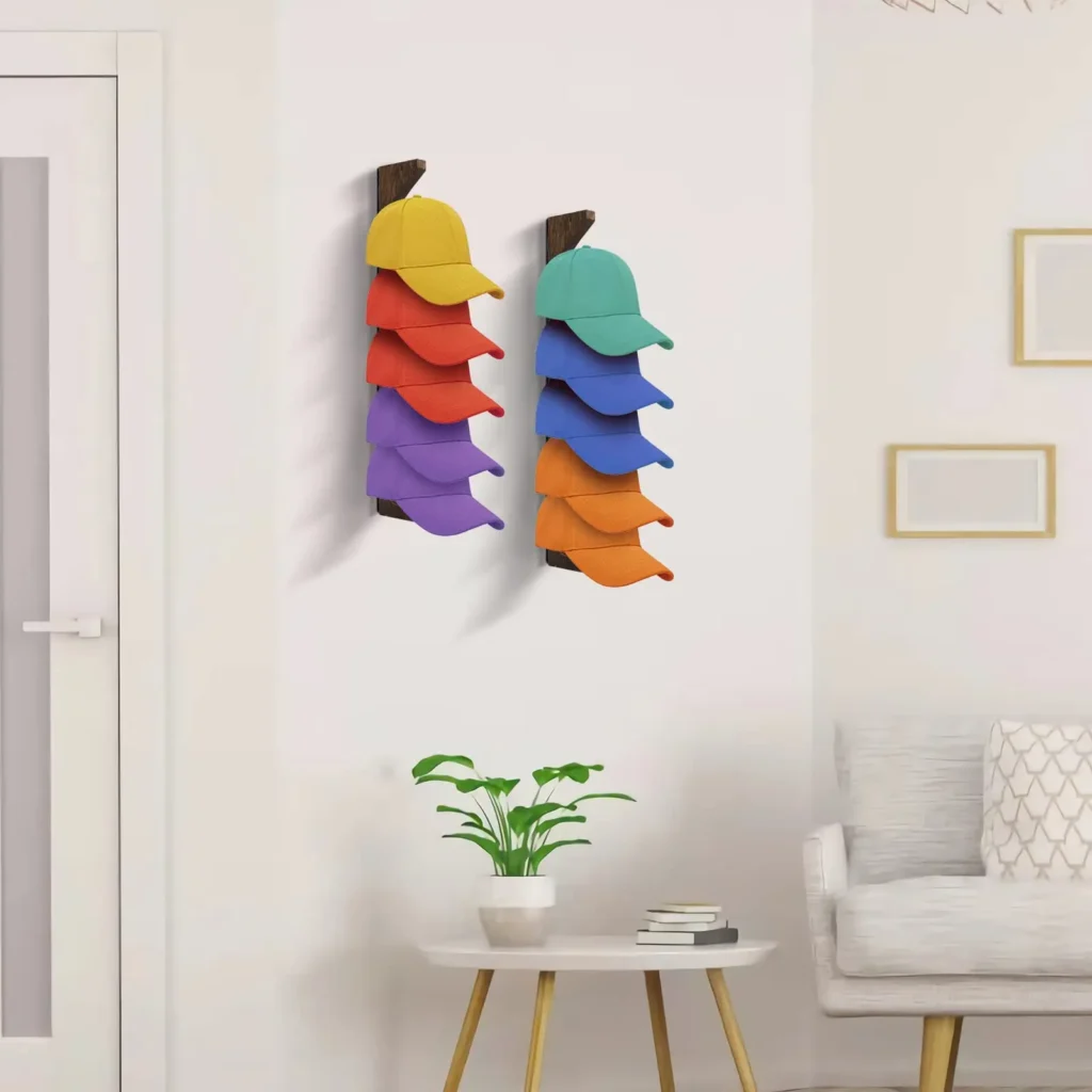 Vertical strap with clips displaying colorful baseball caps on a wall