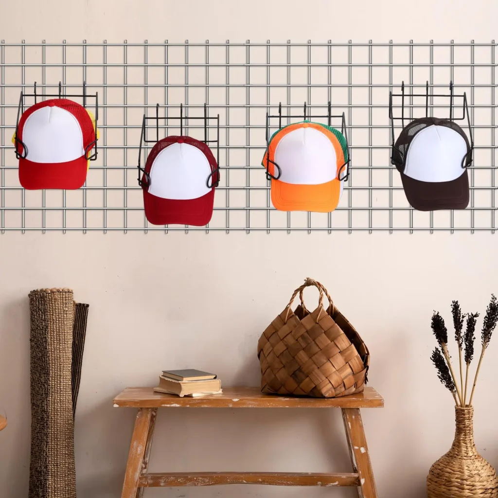 Wall-mounted metal grid panel organizing ten baseball caps