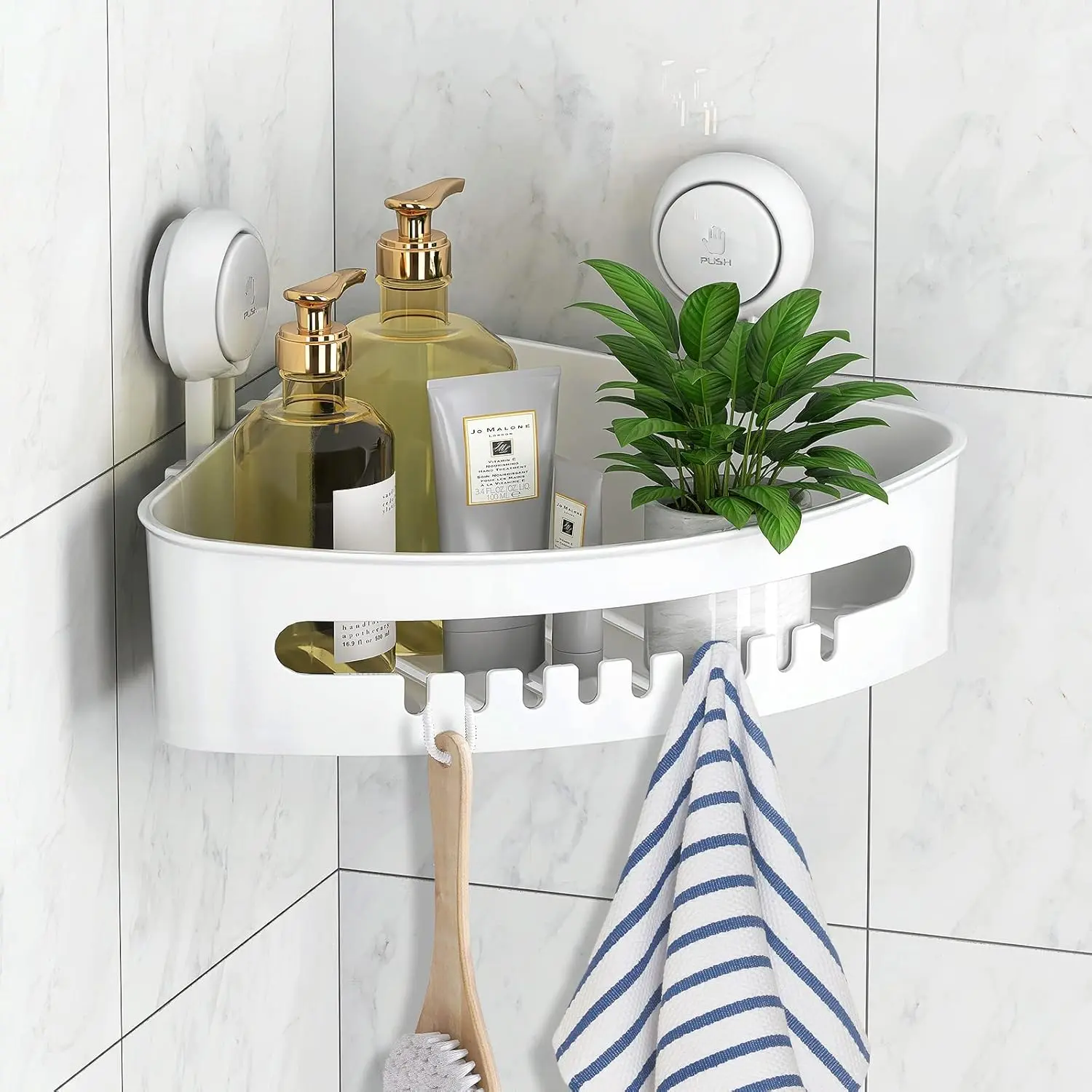 White bathroom corner storage rack holding towels and shampoo bottles