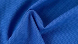 Close-up of nylon fabric texture with smooth synthetic weave