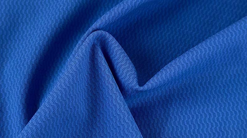 Close-up of nylon fabric texture with smooth synthetic weave