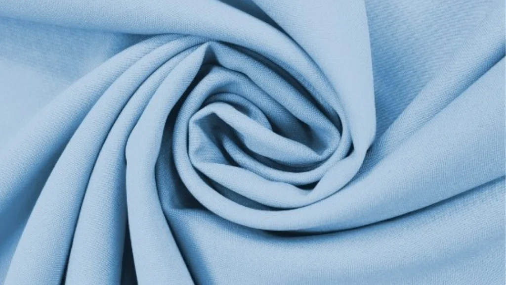 Close-up of polyester fabric texture showing synthetic weave pattern