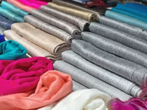 Colorful acrylic scarves stacked neatly