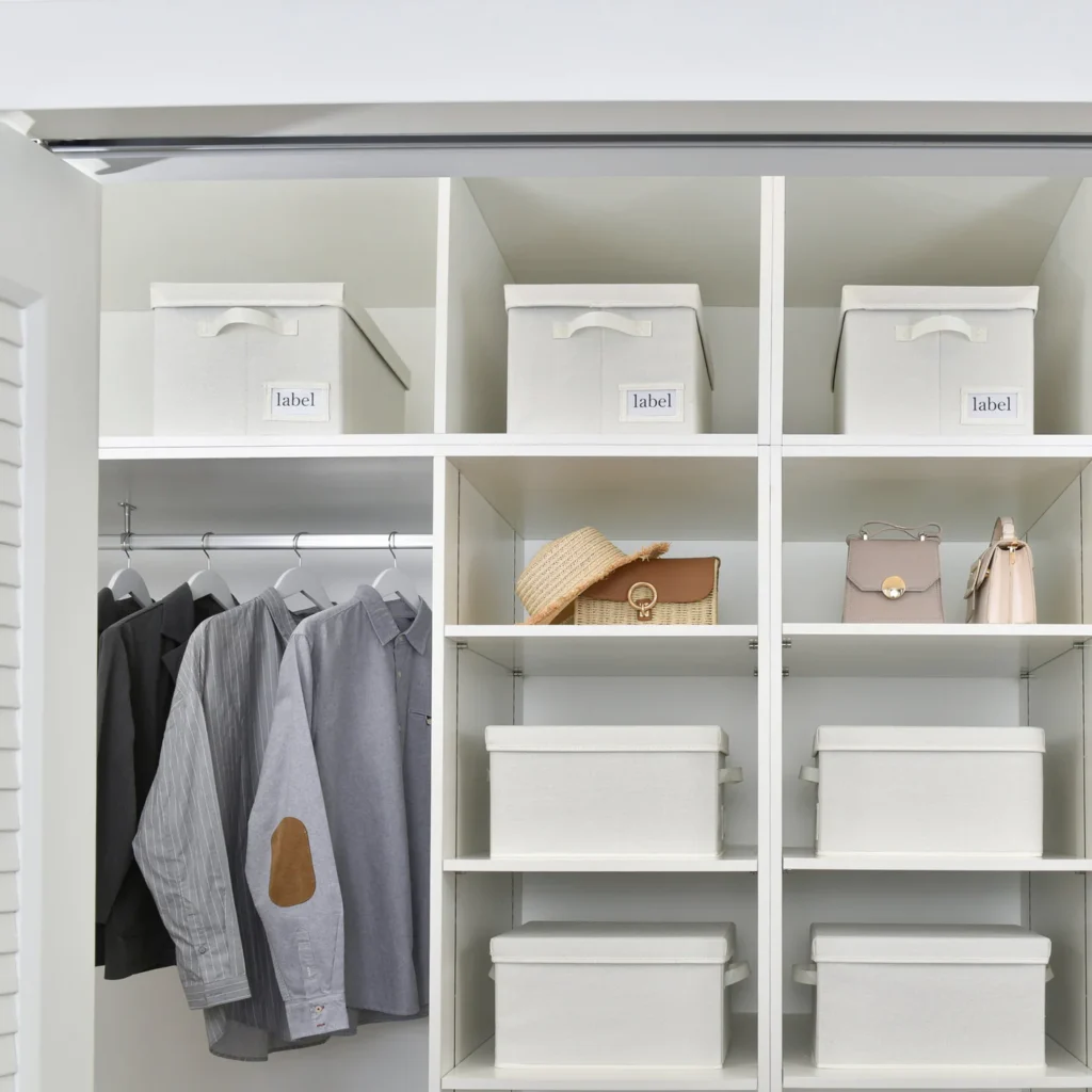 Fabric bins labeled for scarf storage inside organized closet