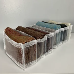 Fabric storage box with chiffon scarves neatly folded inside