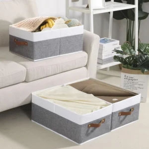 Fabric storage boxes under sofa storing cushion covers and blankets