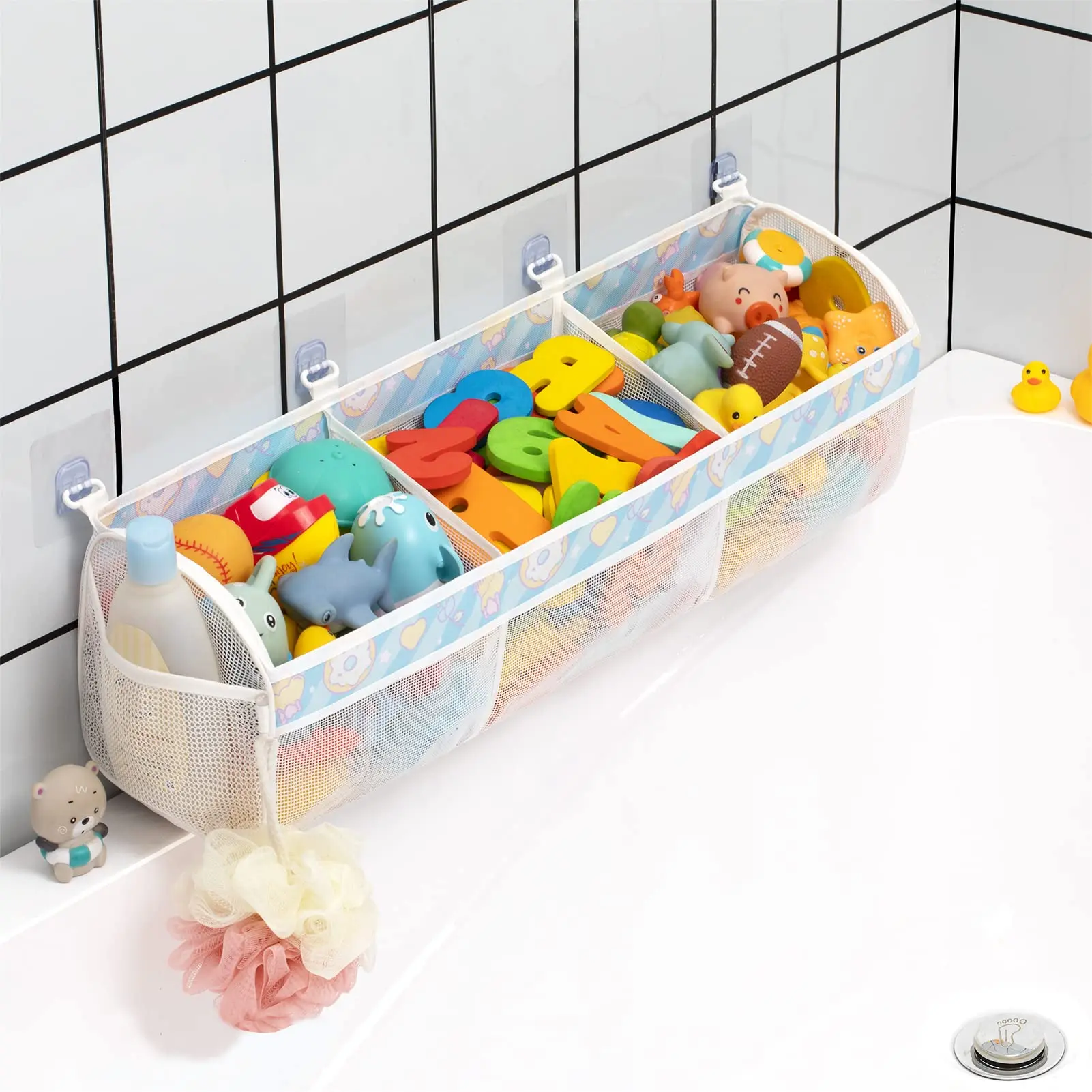 Mesh bath toy storage net attached to bathroom tile wall