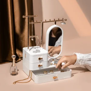 Minimalist jewelry tray on vanity with rings, perfume, and mirror