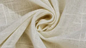 Close-up of linen fabric texture with natural slub pattern