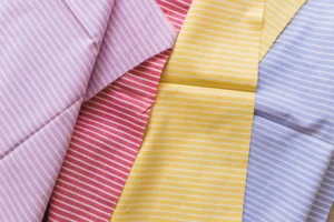 Close-up texture of poplin fabric showing plain weave pattern