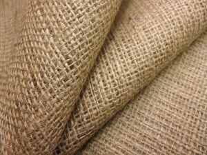 Swatches of natural fabrics including cotton, linen, silk, and wool